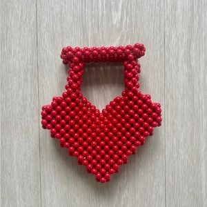 Red heart shaped beaded handbag